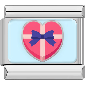 A silver Italian charm featuring a pink heart-shaped gift box with a blue bow.